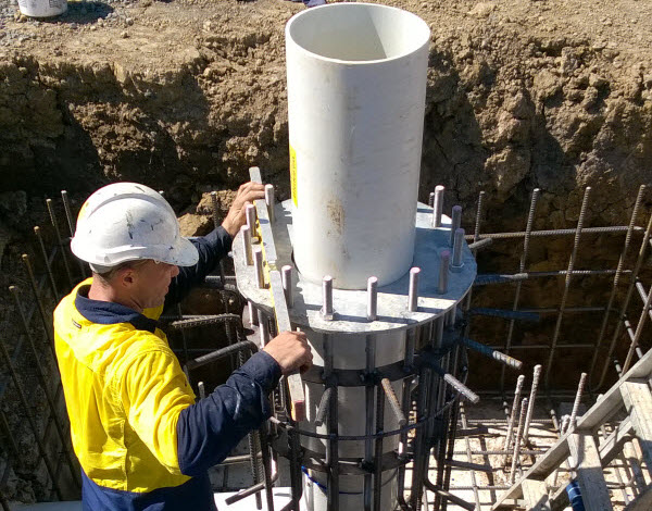 A man installing vent shaft safely