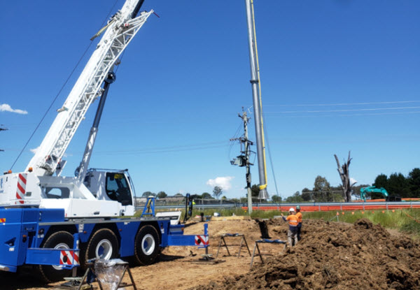 Two men working on the site